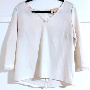 Sezane lace scalloped edge blouse with buttons down the back